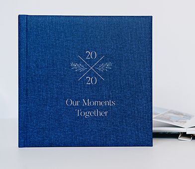 A blue linen layflat photo album